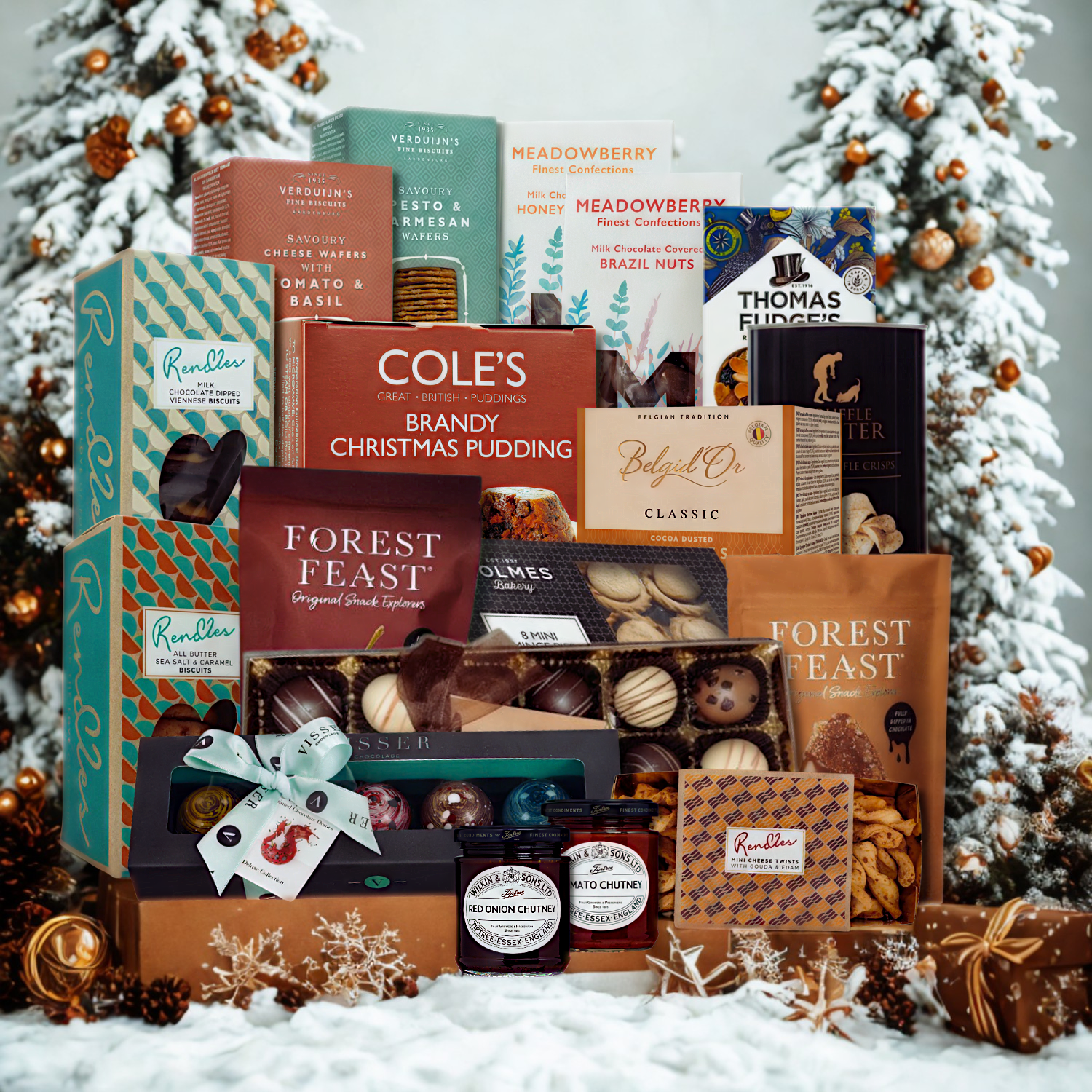 Assorted holiday food products including puddings and jellies displayed in front of a decorated Christmas tree.
