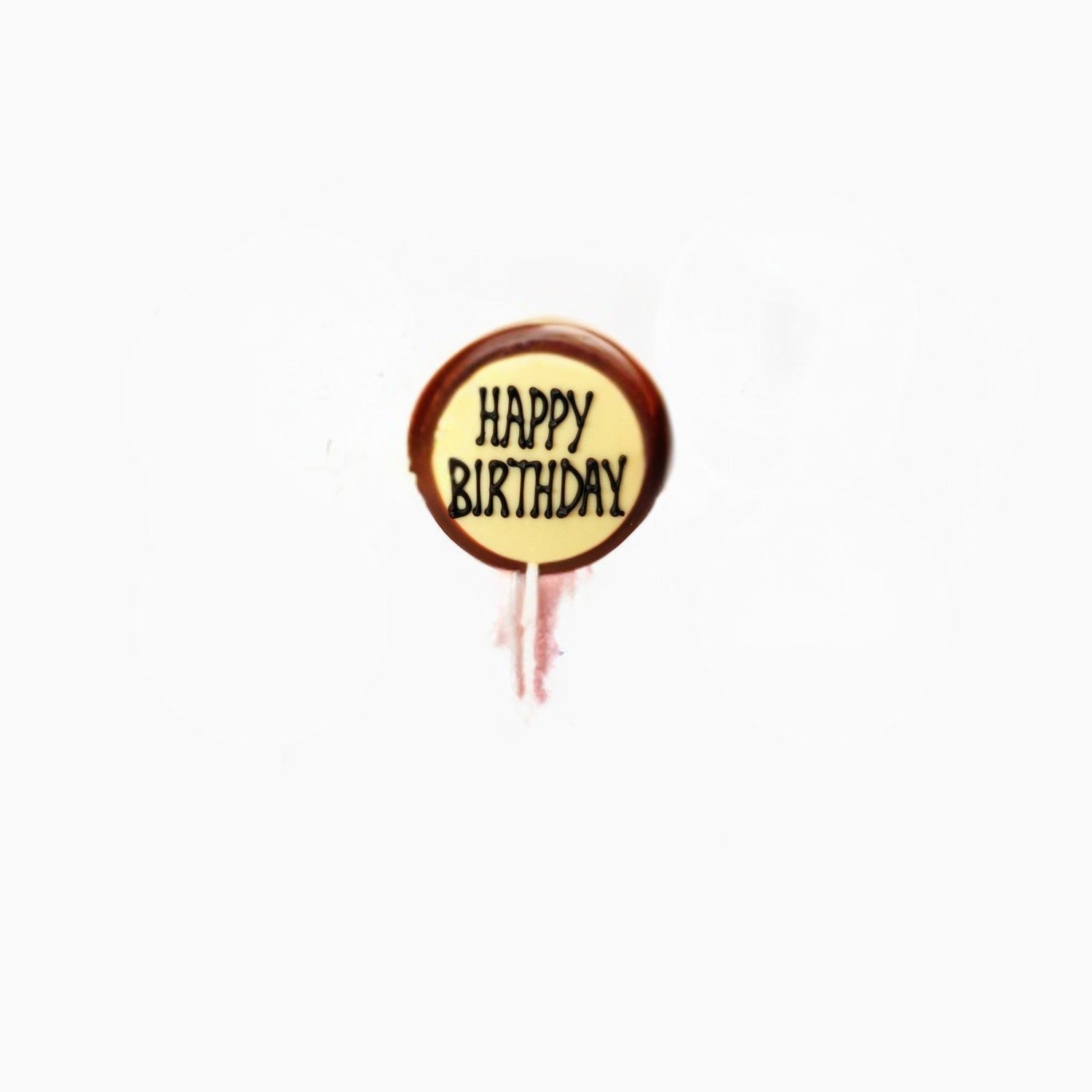 Chocolate lollipop with 'Happy Birthday' text on a white background